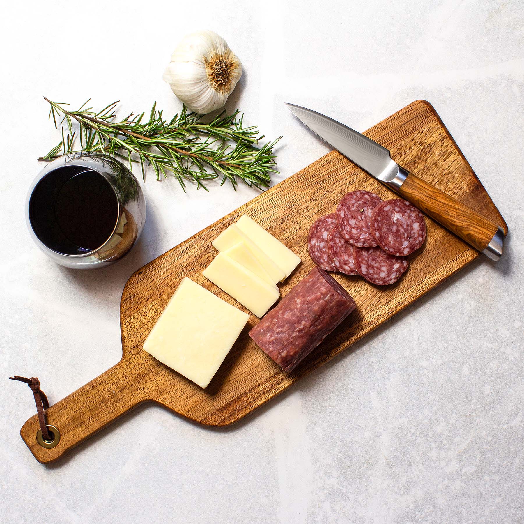 totally-bamboo-rock-branch-acacia-wood-wine-bottle-shaped-cutting-board image 2