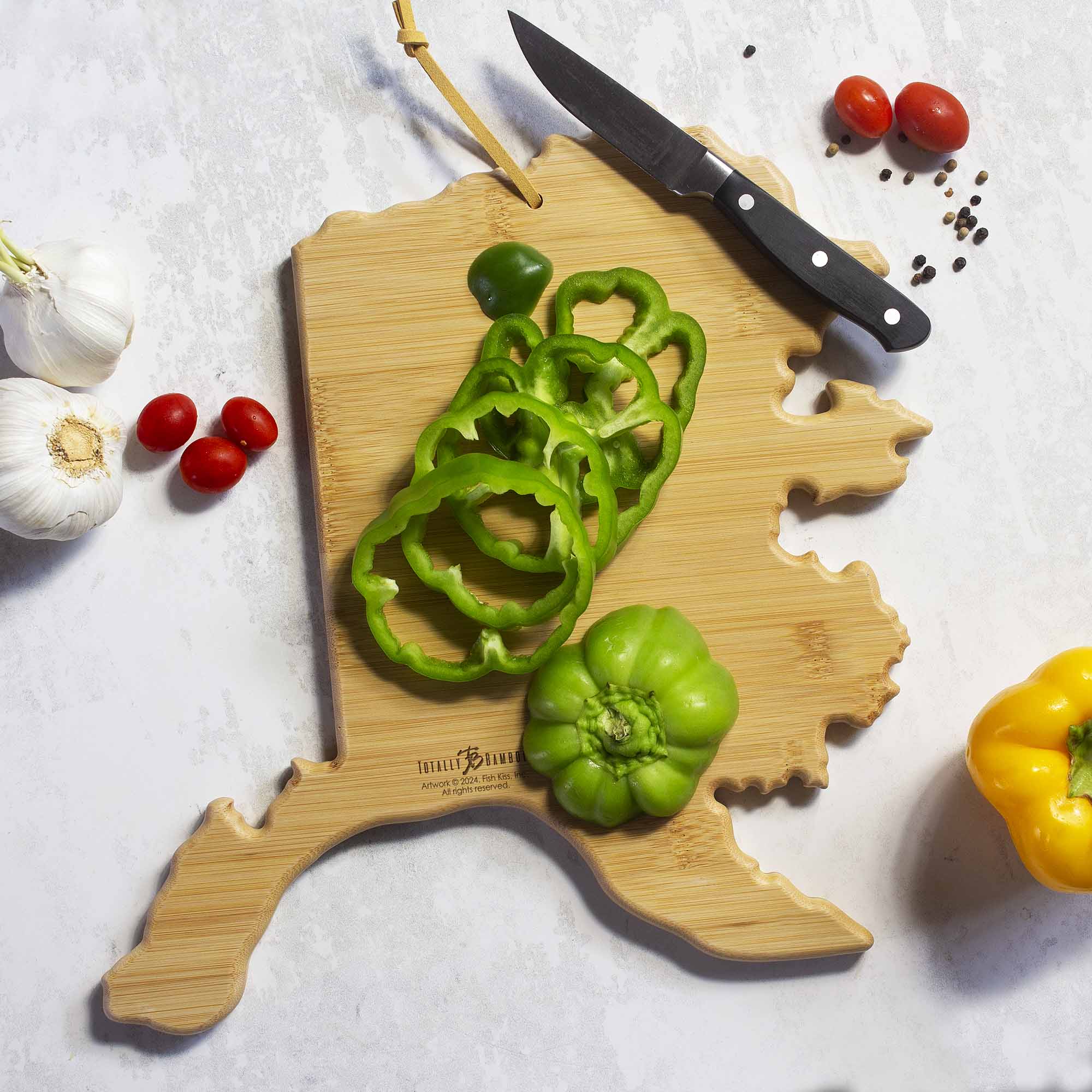 totally-bamboo-alaska-state-shaped-cutting-board-with-fish-kiss-artwork-by-anne- image 3