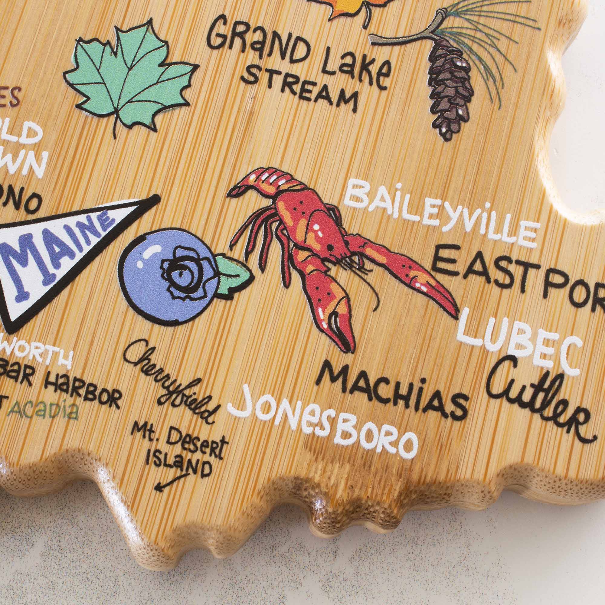 totally-bamboo-maine-state-shaped-cutting-board-with-fish-kiss-artwork-by-anne-k image 7