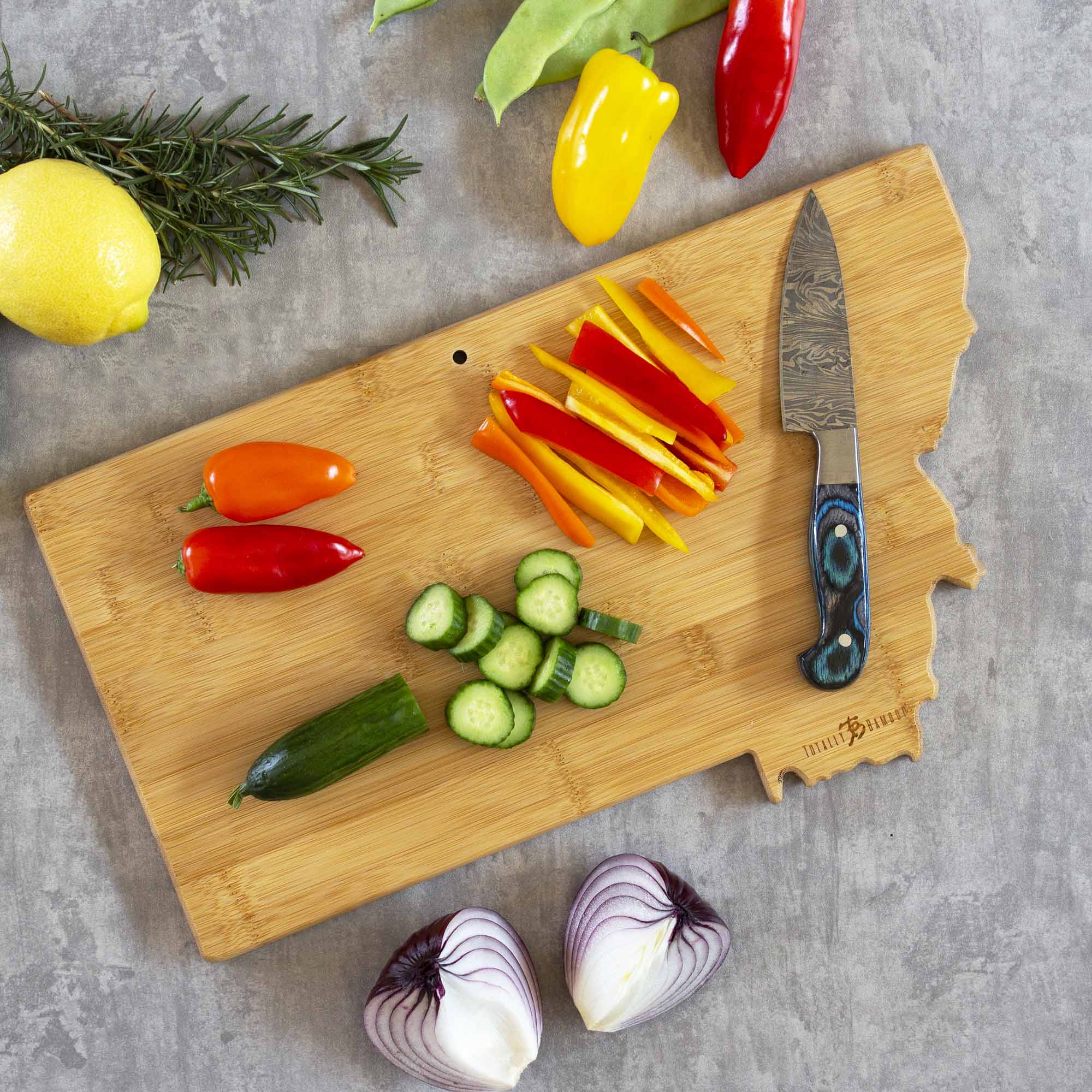 totally-bamboo-montana-state-shaped-cutting-board-with-fish-kiss-artwork-by-anne image 4