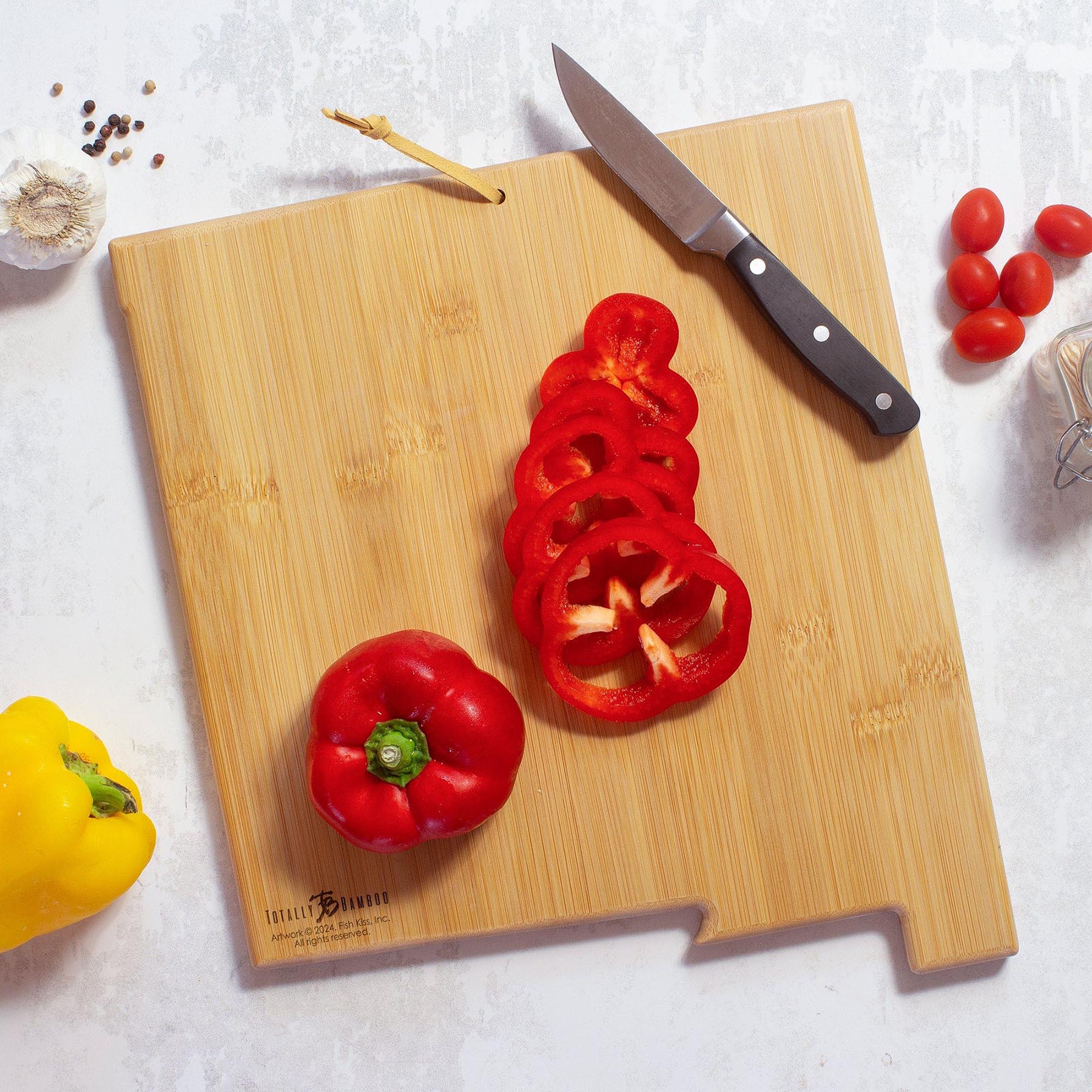 totally-bamboo-new-mexico-state-shaped-cutting-board-with-fish-kiss-artwork-by-a image 4