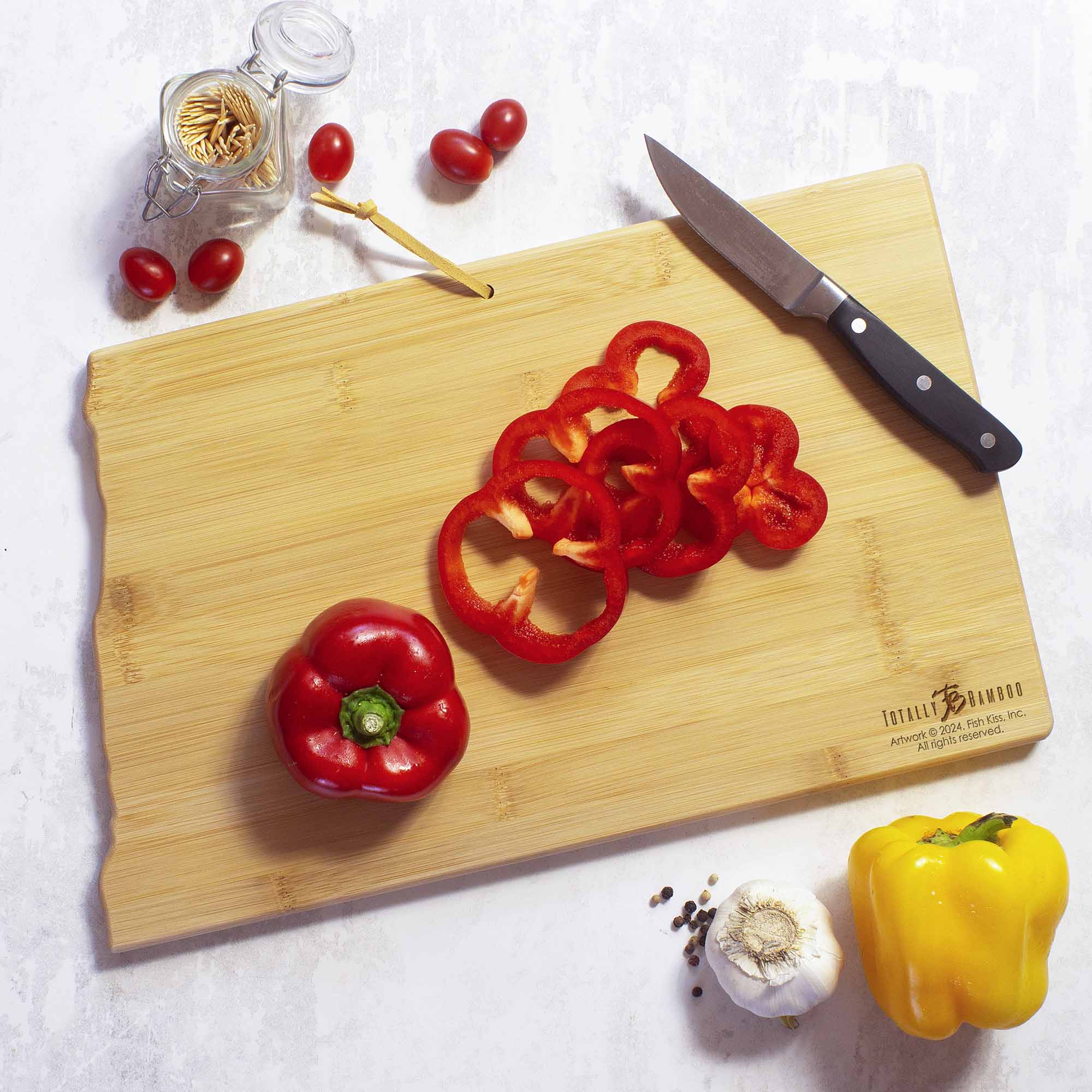 totally-bamboo-north-dakota-state-shaped-cutting-board-with-fish-kiss-artwork image 3