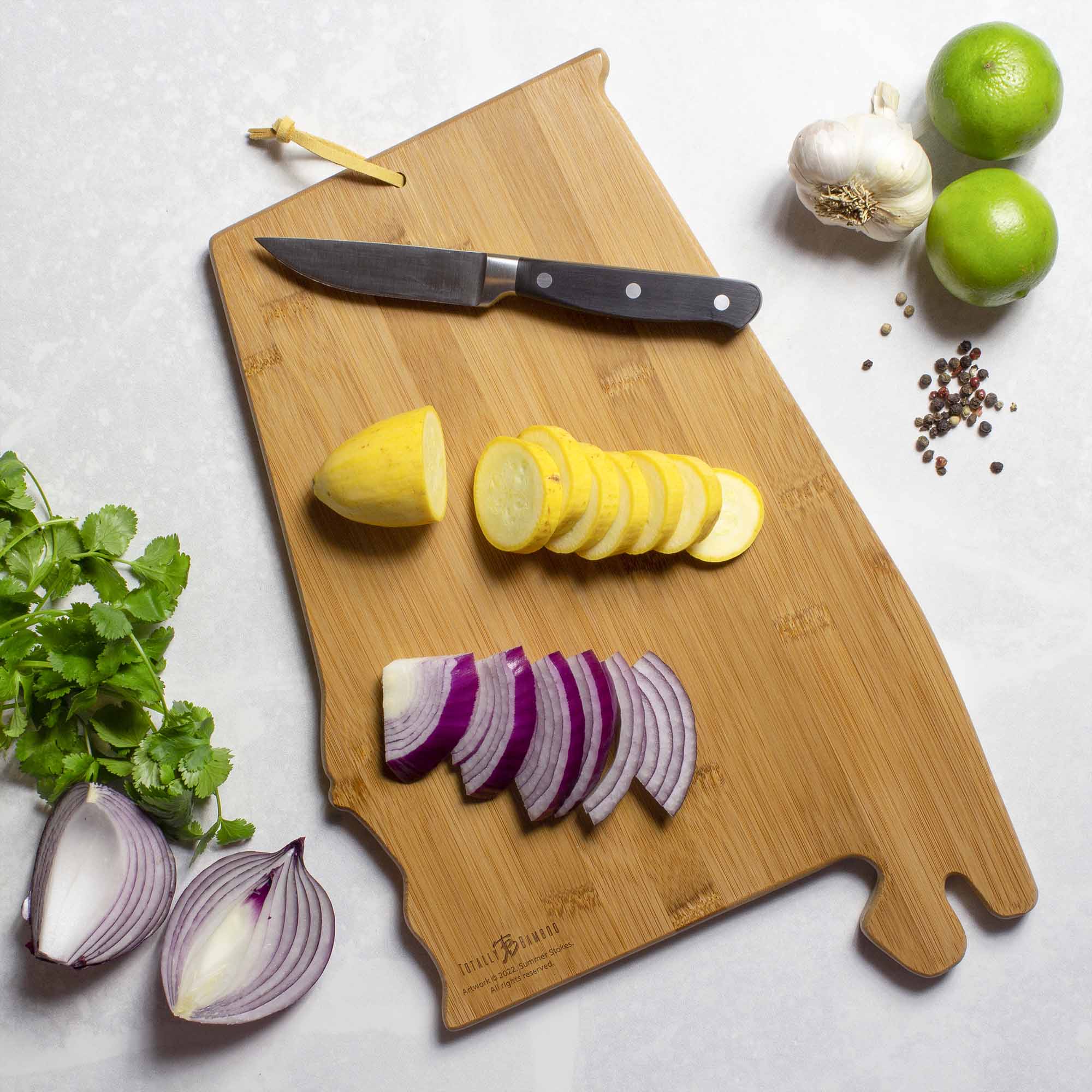 totally-bamboo-alabama-cutting-board-with-artwork-by-summer-stokes-state-shaped- image 3