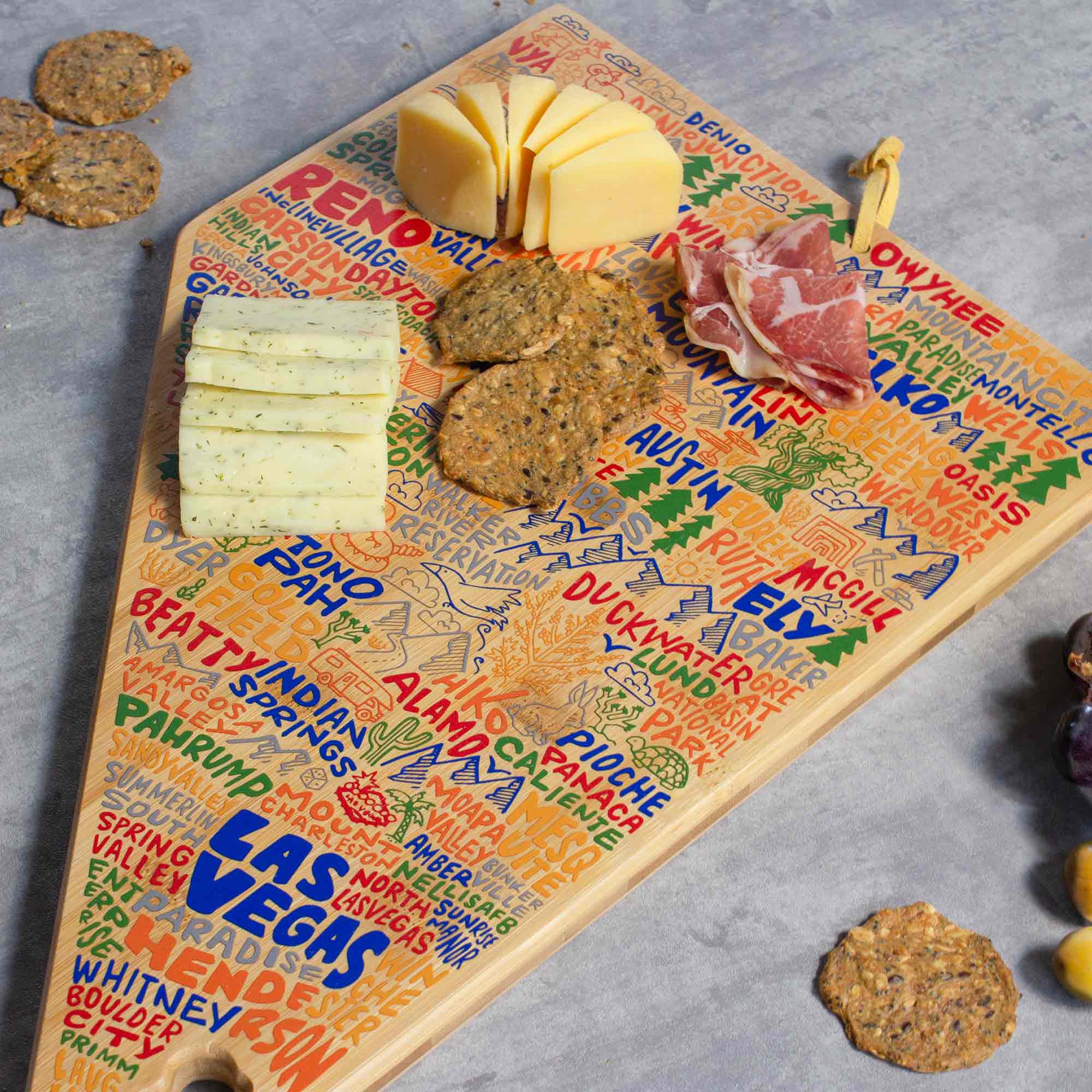 totally-bamboo-nevada-state-shaped-cutting-board-with-wander-on-words-artwork image 3