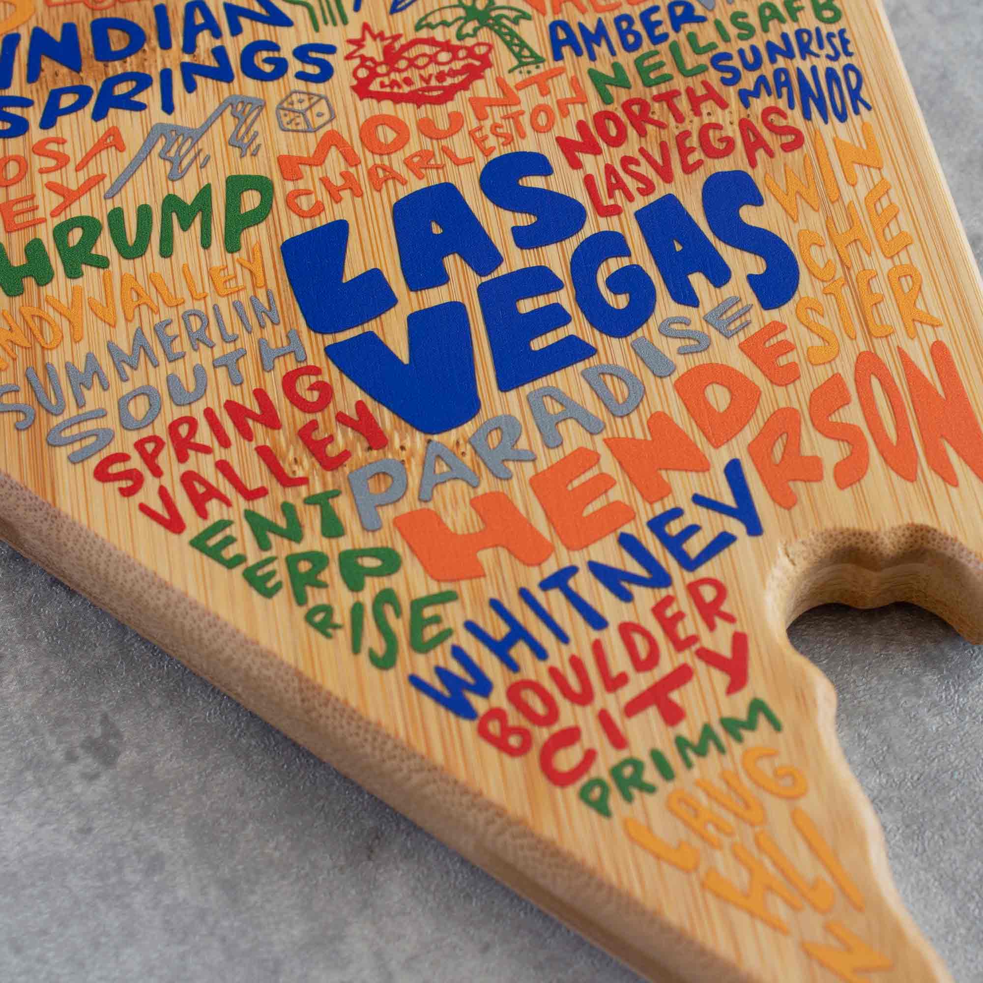 totally-bamboo-nevada-state-shaped-cutting-board-with-wander-on-words-artwork image 6